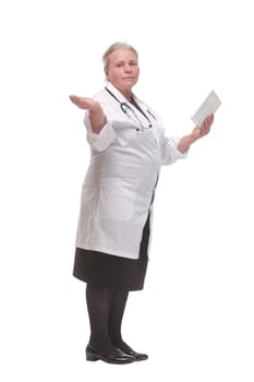 Side view of a doctor using a tablet computer - isolated over a white background. Healthcare, medical and technology concept