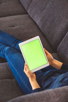 Young caucasian woman holding credit card and using laptop computer. Businesswoman working at home. Online shopping, e-commerce, internet banking, spending money, working from home concept. High quality photo