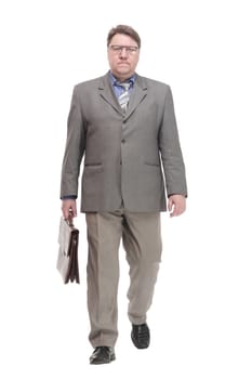 full-length. business man with a leather briefcase. isolated on a white background.