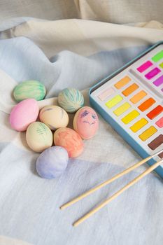 Easter, festive mood. Painted multi-colored Easter eggs which are painted with watercolor paint, hand-painted