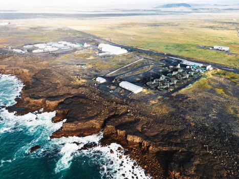 Water treatment plant for environment or healthy concept somewhere in Iceland by the sea on a sunny day in autumn.