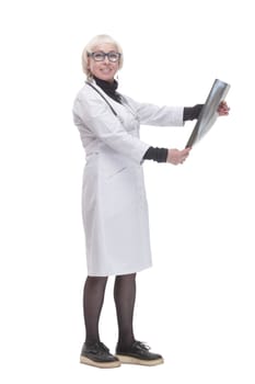in full growth. female doctor with an x-ray. isolated on a white background.