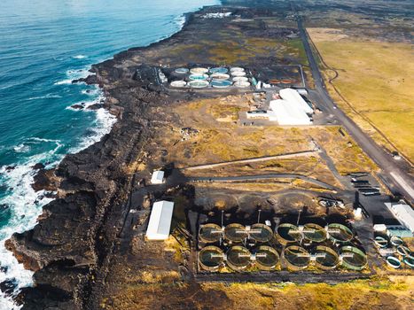 Water treatment plant for environment or healthy concept somewhere in Iceland by the sea on a sunny day in autumn.