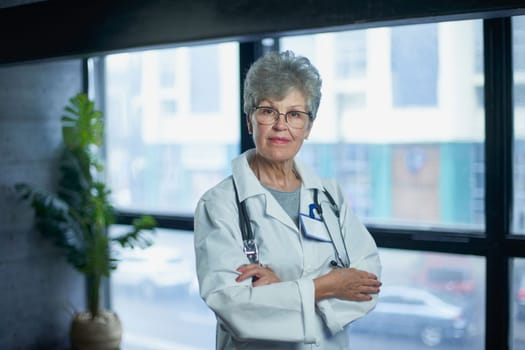 Friendly mature female doctor at hospital smiling