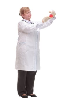 Smiling scientist or doctor holding a flask gives the thumbs up. Isolated on white.