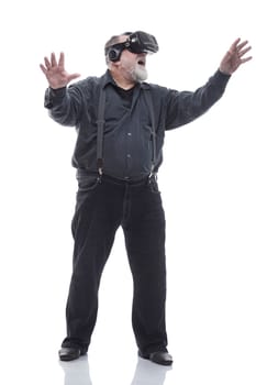 full- length . modern adult male in a virtual reality helmet. isolated on a white background