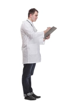 Happy smiling doctor writing on clipboard, isolated on white background