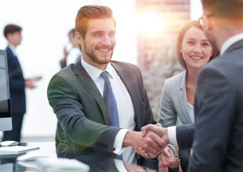 Picture showing manager introducing new worker to the team