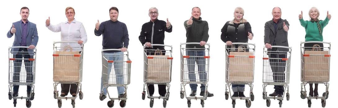 group of people with shopping cart showing thumbs up isolated on white background