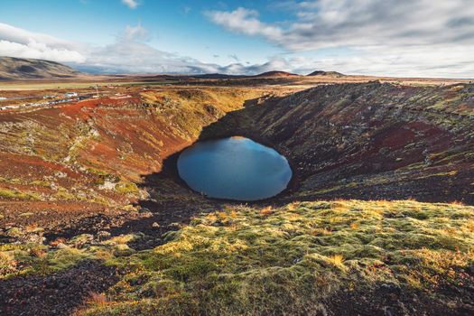 Top view of the Kerid crater with blue lake at sunrise. The Golden Circle tour. Iceland landscape. High quality photo