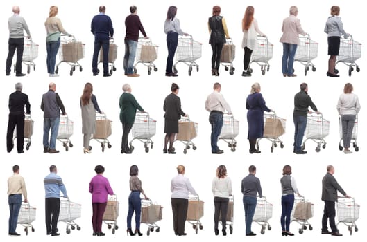 a group of people with a cart stand with their backs isolated on a white background