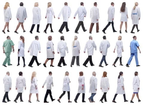 group of doctors in motion isolated on white background