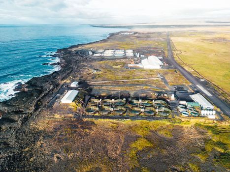 Water treatment plant for environment or healthy concept somewhere in Iceland by the sea on a sunny day in autumn.