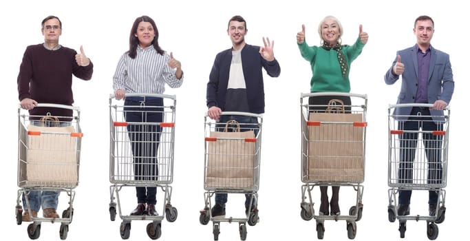 group of people with shopping cart showing thumbs up isolated on white background