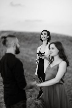 wedding ceremony of a girl and a guy on high hills near the sea