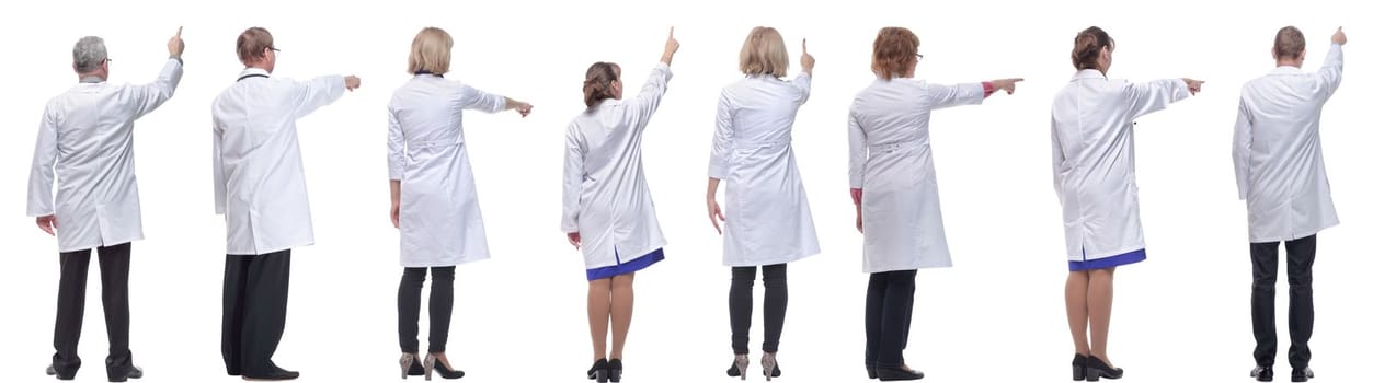 group of doctors standing with their backs isolated on white background