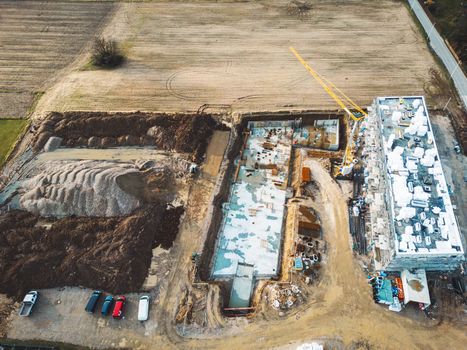 Aerial view of construction site somewhere in the country side of Slovenia. Construction site of new residential building in the countryside. 