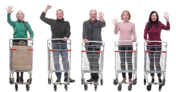 group of people with shopping cart showing thumbs up at camera isolated on white background