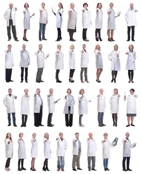 group of doctors in full length isolated on white background