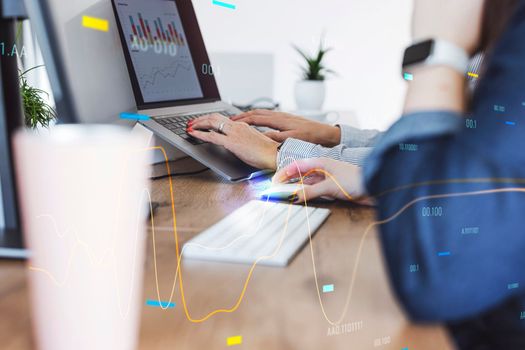 Professional businesswoman working at her office via laptop, young female manager using computer device while sitting at modern loft, computer graphics, work process concept. High quality photo