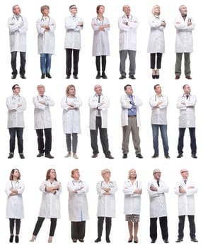 group of doctors standing in full length isolated on white background