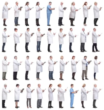 full length group of doctors with notepad isolated on white background