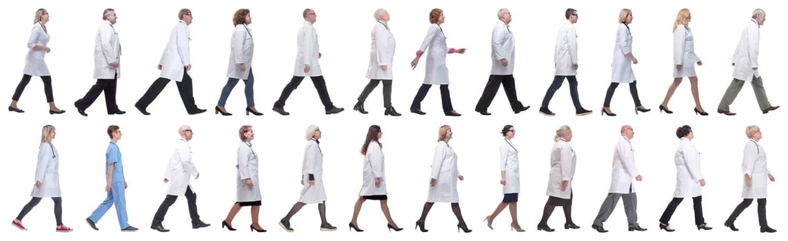 group of doctors in motion isolated on white background