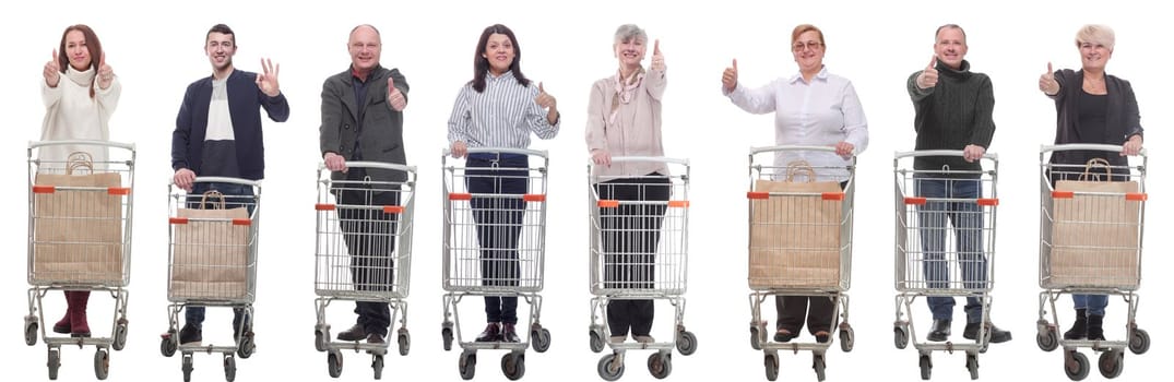 group of people with shopping cart showing thumbs up isolated on white background