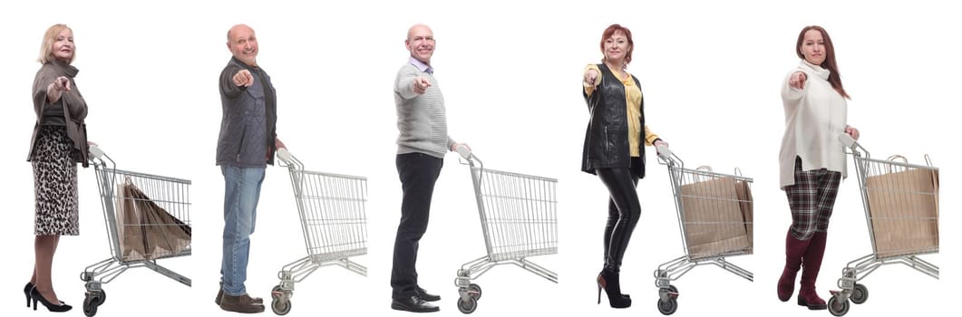 a group of people with a shopping cart point their finger at the camera on a white background