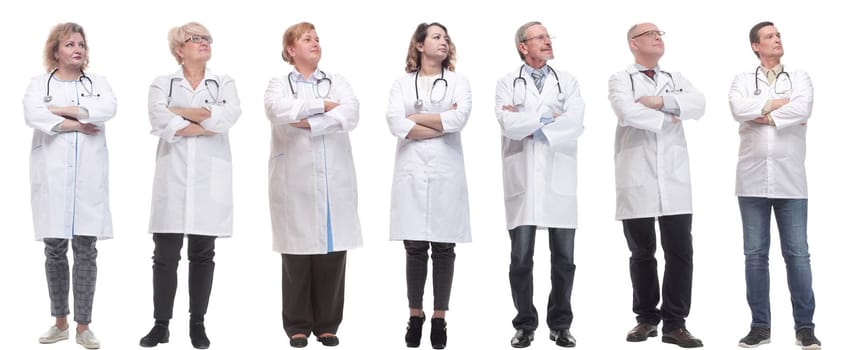 group of doctors standing in full length isolated on white background