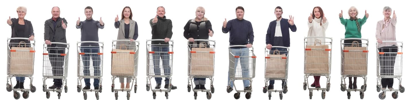 group of people with shopping cart showing thumbs up isolated on white background