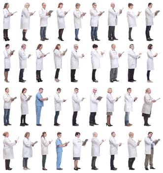 full length group of doctors with notepad isolated on white background