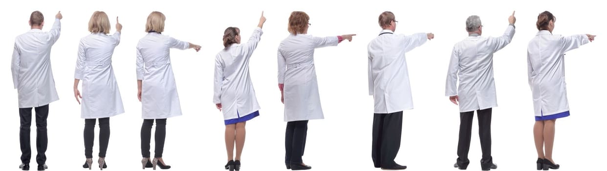 group of doctors standing with their backs isolated on white background