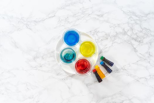 Coloring hard-boiled white eggs with natural food coloring.