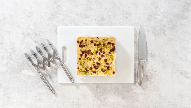 Flat lay. Storing cranberry pistachio fudge into the reusable plastic bag.