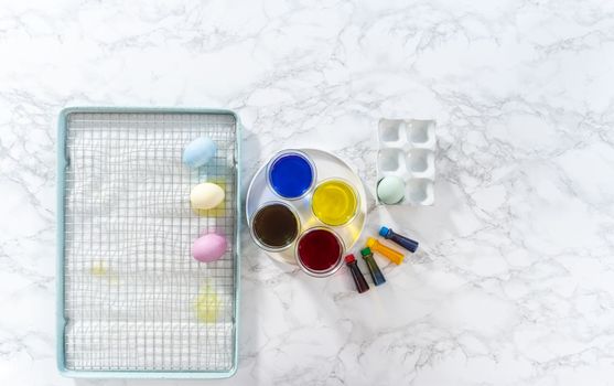 Coloring hard-boiled white eggs with natural food coloring.