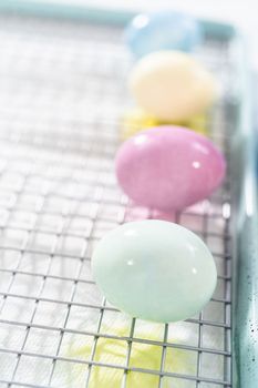 Coloring hard-boiled white eggs with natural food coloring.