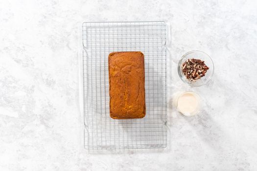Flat lay. Colling freshly baked pumpkin bread on a kitchen cooling rack.