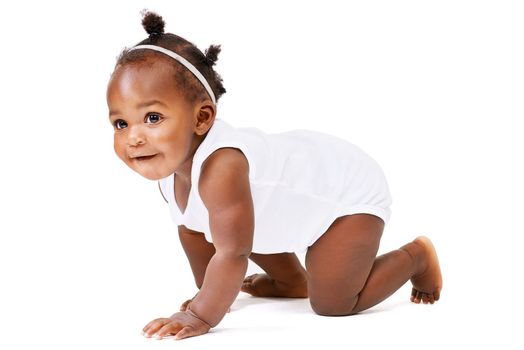 Fun and adventure awaits...Studio shot of a baby girl crawling against a white background