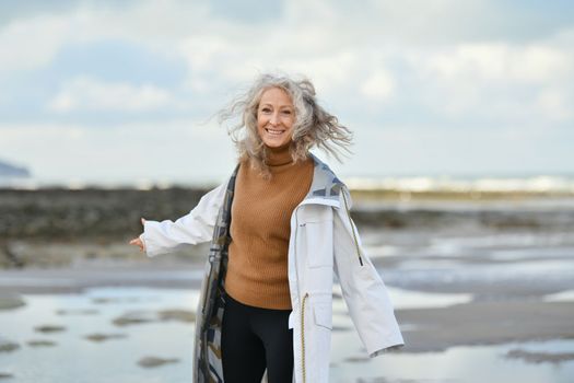 Portrait of a fifty-year-old woman with a white smile