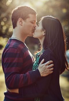 Love is life. an affectionate young couple kissing outdoors