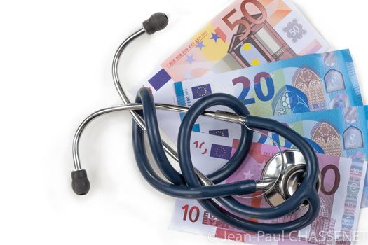 stethoscope and euro banknotes, symbolic photo, risks for medical services