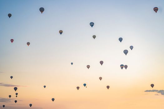 Beautiful hot air balloons over blue sky.