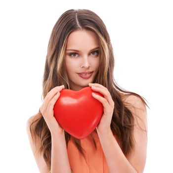 Face portrait, heart balloon and woman in studio isolated on white background. Love, affection and young female model holding symbol for romance, valentines passion or romantic emoji, care or empathy.