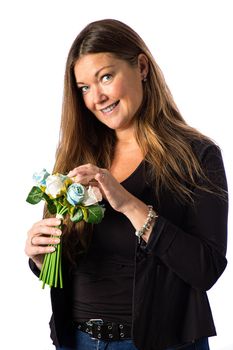 Isolated portrait of a forty year old woman in a sport coat, holding blue and white roses in a bouquet