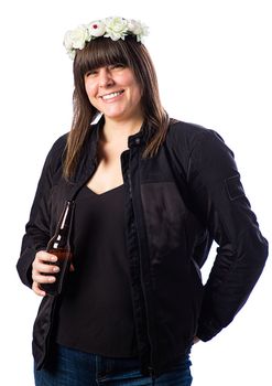 Isolated portrait of a forty year old woman, wearing a biker coat and crown of roses, holding a brown bottle of beer