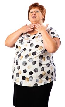 Isolated portrait of a fifty year old overweight red hair woman touching her neck