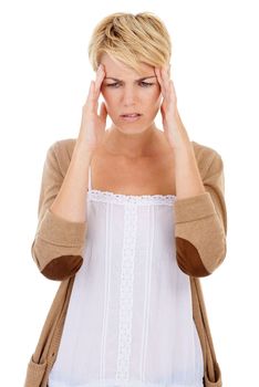 Dealing with a painful headache. A young woman suffering from a headache brought on by her fast-paced modern lifestyle