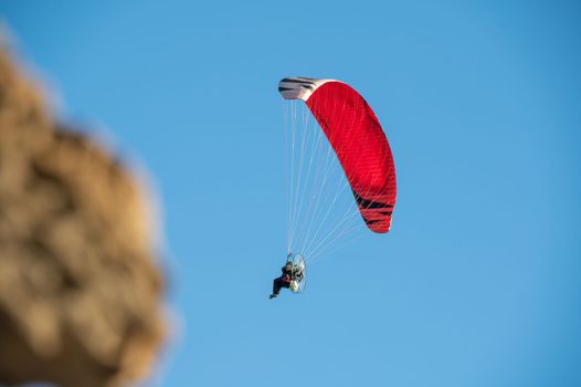 Power paragliding on a clear day in Nerja in Malaga in Spain in autumn 2022.