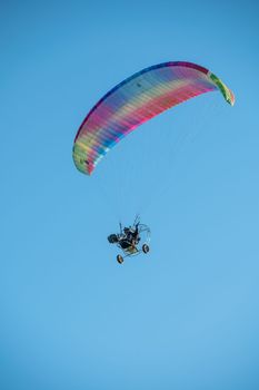Power paragliding on a clear day in Nerja in Malaga in Spain in autumn 2022.